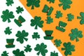 Happy St. PatrickÃ¢â¬â¢s Day. Green hat and shamrock pattern on white and orange background.